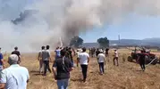 Orhaneli’nde tarlada başlayan yangını köylüler söndürdü