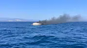 Didim açıklarında yanan tekne sulara gömüldü