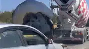 Ayvalık yolunda alev alan otomobile beton mikserinden hayat kurtaran müdahale