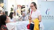 MCBÜ aday öğrencilerle alışveriş merkezinde bir araya geldi