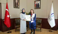 Dünya şampiyonu Nurbade Büber Rektör Kibar ile bir araya geldi