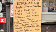 Afyonlu esnafın camına astığı kedi notu herkesi gülümsetti