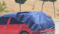 Elazığ’da kavurucu güneş otomobilleri branda altına soktu