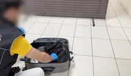 Valizin astarına gizlenen sıvı uyuşturucuyu Mailo fark etti