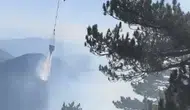Fethiye'nin sarp yamaçlarında alevlerle zorlu mücadele