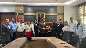 Eskişehirli muhtarlar görev yeri değişen Kaymakam Ulu’yu uğurladı