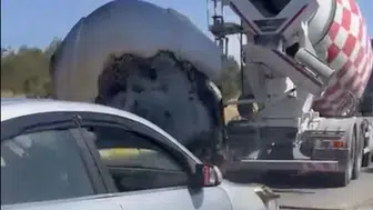 Ayvalık yolunda alev alan otomobile beton mikserinden hayat kurtaran müdahale