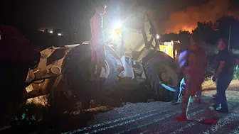 Serik'te alevlerle mücadele sürerken iş makinesi kazası yaşandı