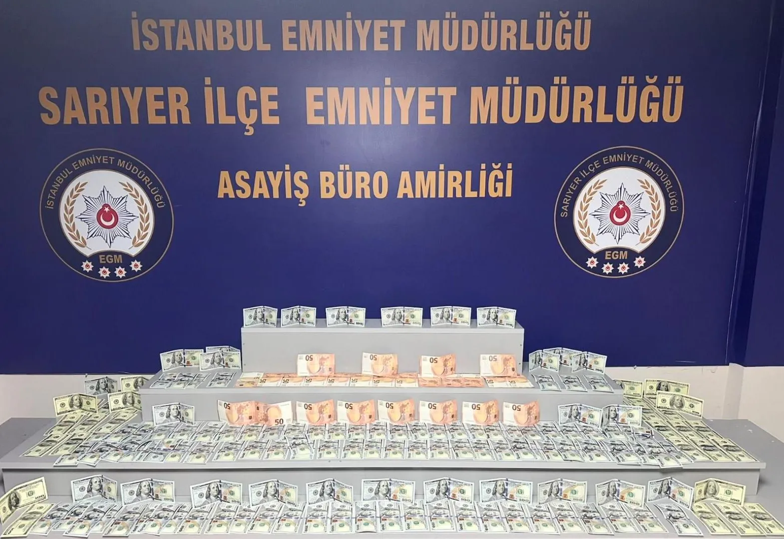 Bankada sahte dolar bozdurmaya çalışan kadına suçüstü